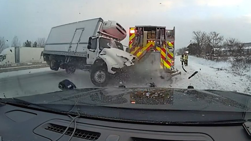 Box truck loses control, hits fire truck on Michigan highway, video shows