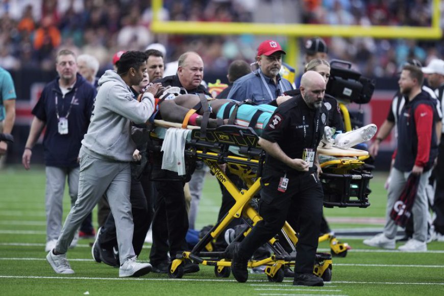 Miami Dolphins wide receiver Grant DuBose taken off the field on a stretcher after hit to the head