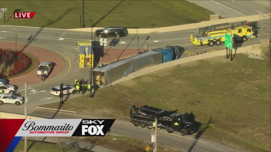 Tractor trailer overturns on Wildwood roundabout, driver rescued