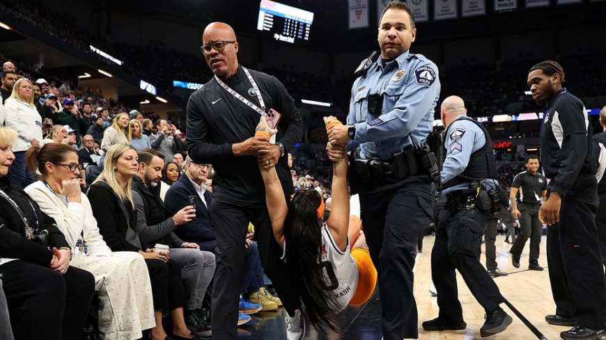 Security guards tackle two women to the ground during Knicks-Timberwolves game after they ran onto court