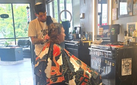Citing economy, Zeus Room Barbershop drops haircut prices