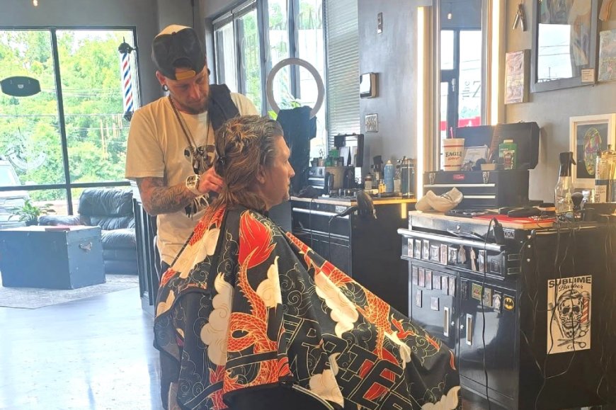 Citing economy, Zeus Room Barbershop drops haircut prices